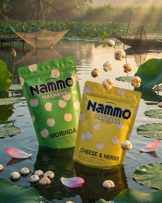 Two packages of Nammo snacks on a reflective water surface with a natural background